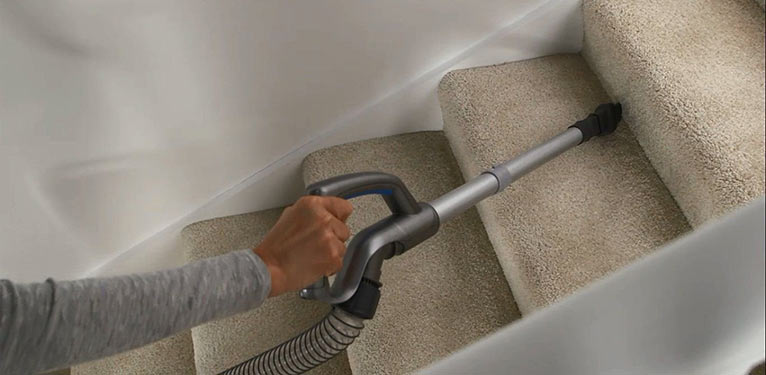 cleaning stairs with vacuum cleaner